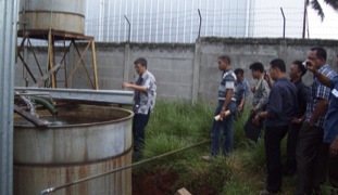 Staff of a big national company explains the modern technique of Patchouli Oil distillation 