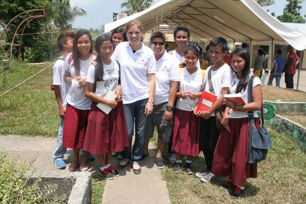 Kelly Schut, representative of Caritas CR among pupils in Basey after ceremony.