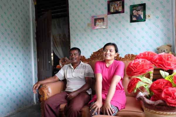 Buyung Arta lives with her daughter Nurlinda in house built by CRS (photo by P. Nicholson/CI)