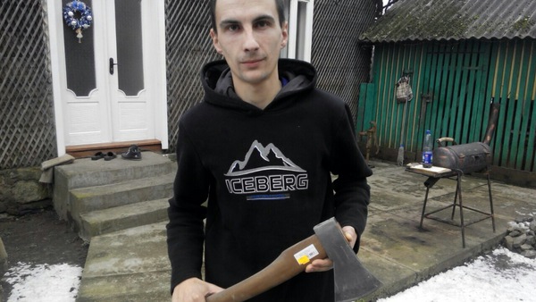  The young man shows a new ax.