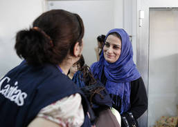 Handing over blankets and hygiene package