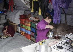 Morning preparation of lunch in a refugee tent