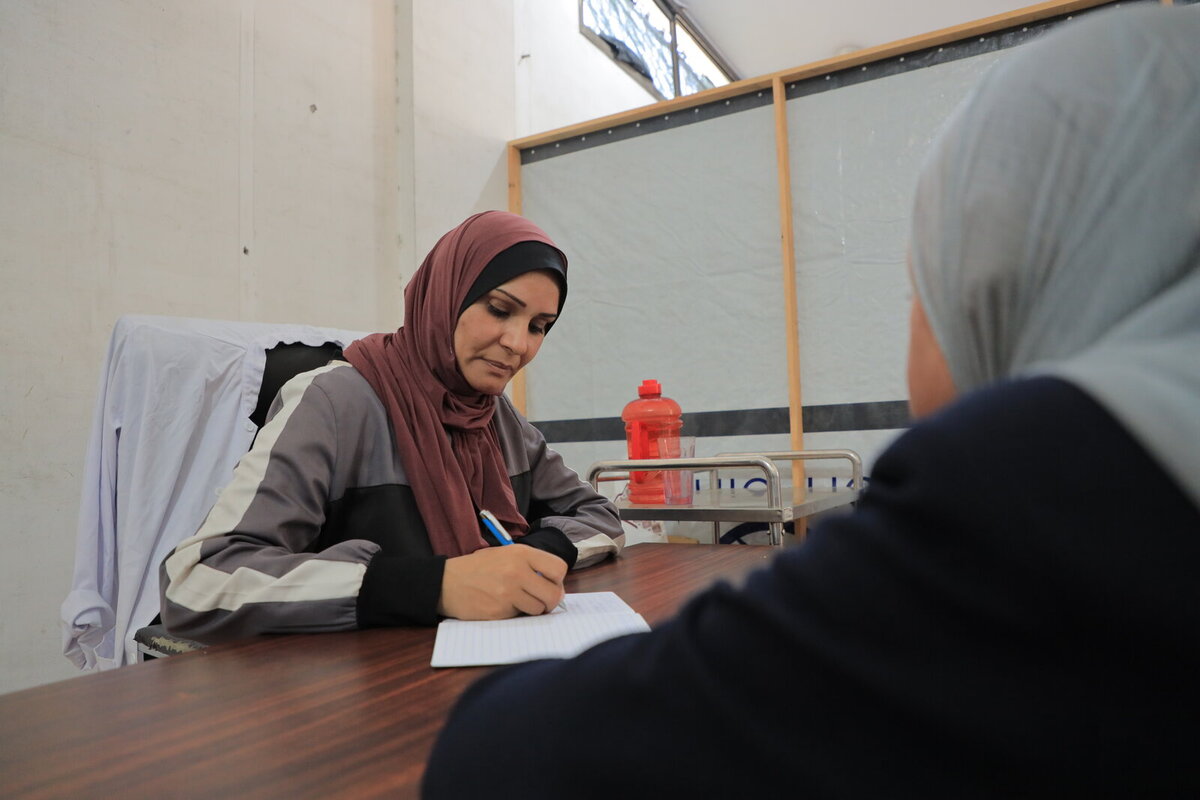 Aida and her son during a session at the clinic of Charity Jerusalem Aida and her son during a session at the clinic of Charity Jerusalem